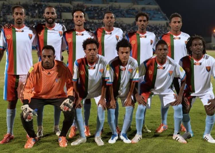 Eritrea national football team players line up for a team photo just before the start of the FIFA World cup qualifying match at Francistown's Stadium on October 13, 2015. Ten footballers from Eritrea's national squad have sought political asylum in Botswana after playing in a qualifying match for the 2018 World Cup, an Eritrean non-governmental organisation said October 16. The players were part of the national team -- known as the Red Sea Camels -- that lost 3-1 to Botswana in Francistown on October 13. AFP PHOTO / MONIRUL BHUIYAN (Photo by Monirul Bhuiyan / AFP)