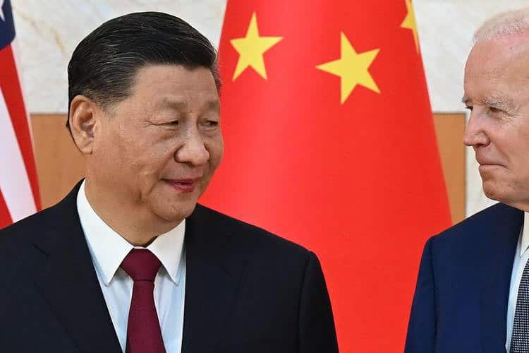 US President Joe Biden (R) and China's President Xi Jinping (L) meet on the sidelines of the G20 Summit in Nusa Dua on the Indonesian resort island of Bali on November 14, 2022. (Photo by SAUL LOEB / AFP)