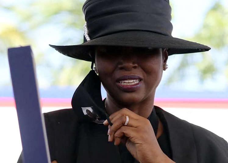 Martine Moïse grieves during the funeral for her husband, slain Haitian President Jovenel Moïse, on July 23, 2021, in Cap-Haitien, Haiti, the main city in his native northern region. Moïse, 53, was shot dead in his home in the early hours of July 7. (Photo by Valerie BAERISWYL / AFP)