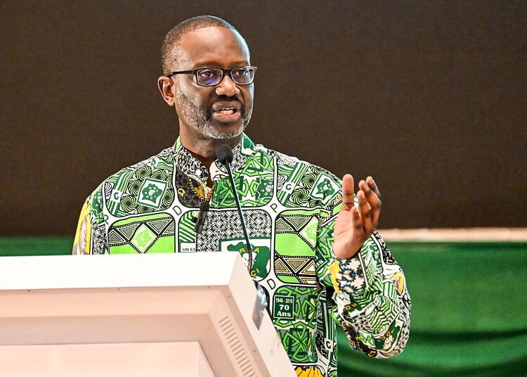 Tidjane Thiam, former Ivorian minister and candidate for the presidency of the Democratic Party of Ivory Coast (PDCI) in 2025, delivers a speech at the Felix Houphouet Boigny Foundation for Peace Research, for a campaign meeting in Yamoussoukro on December 9, 2023. (Photo by Sia KAMBOU / AFP)