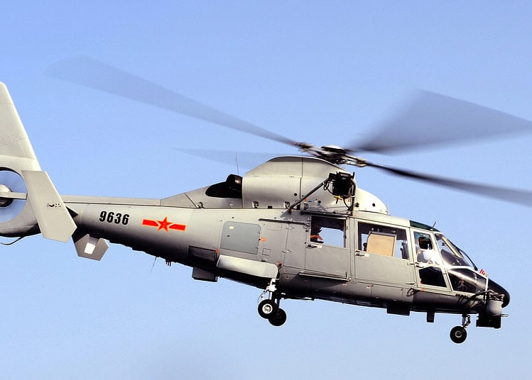 A Chinese Haifan II helicopter from the missile frigate 'Zhoushan' leaves the flight deck of HMS Cornwall.
Members of the Chinese Public Liberation Army Navy (PLAN) were visiting the Type 22 frigate to discuss anti-piracy operations in the Gulf of Aden.