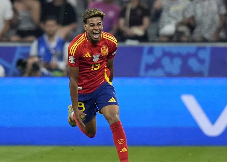 Spain's Lamine Yamal celebrates after scoring his side's first goal during a semifinal match between Spain and France at the Euro 2024 soccer tournament in Munich, Germany, Tuesday, July 9, 2024. (AP Photo/Matthias Schrader)