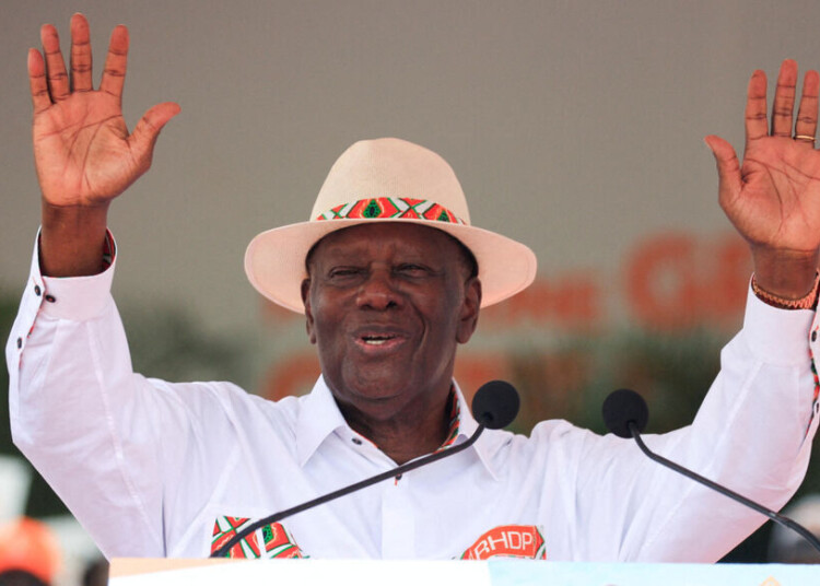 FILE PHOTO: Ivory Coast's President Alassane Ouattara, 83, who is seeking a fourth term, gestures during a campaign rally of the women of RHDP (Rally of Houphouetists for Democracy and Peace), ahead of the Ivory Coast presidential election scheduled on October 25, in Abidjan, Ivory Coast, October 19, 2025. REUTERS/Luc Gnago/File Photo