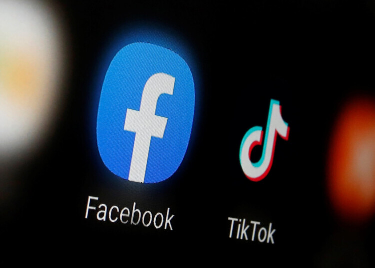 FILE PHOTO: The logos of TikTok and Facebook are displayed on a smartphone in this illustration taken January 6, 2020. REUTERS/Dado Ruvic/Illustration