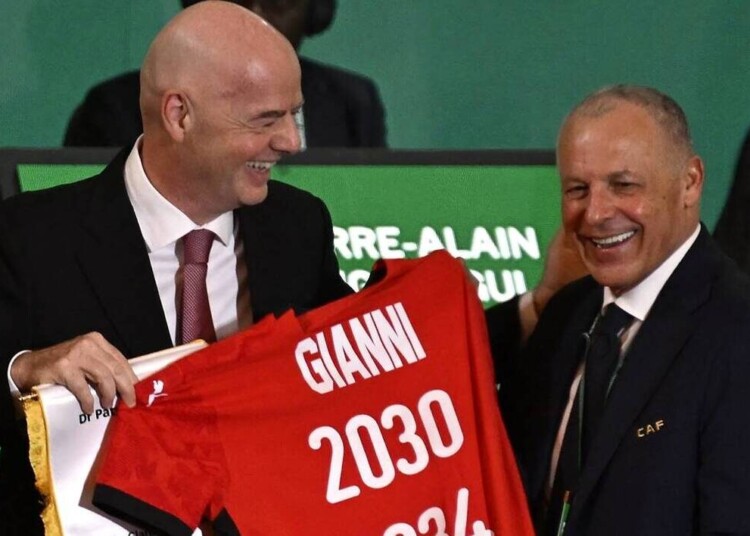 President of Egyptian Football Association Hany Abo Rida (R) presents the President of Fédération Internationale de Football Association (FIFA) Gianni Infantino with a jersey during the Confederation of African Football (CAF) general assembly and the election of a new executive committee, in Cairo, on March 12, 2025. (Photo by Khaled DESOUKI / AFP)