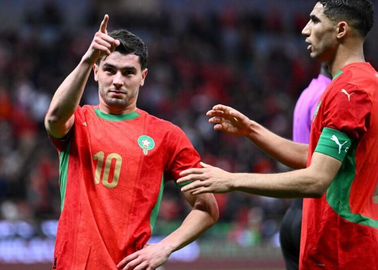 Morocco's forward #10 Brahim Diaz celebrates scoring his team's first goal with Morocco's defender #02 Achraf Hakimi during the Africa Cup of Nations (CAN) round of 16 football match between Morocco and Tanzania at Prince Moulay Abdallah Stadium in Rabat on January 4, 2026. (Photo by SEBASTIEN BOZON / AFP)
