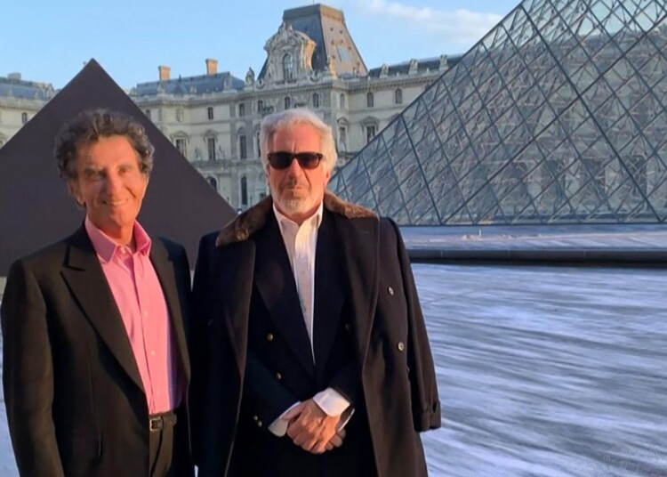 TOPSHOT - A screengrab taken on February 3, 2026 from a video released in files related to the investigation into the late convicted sex offender Jeffrey Epstein, published by the US Department of Justice, shows Jack Lang, a French former culture minister posing with Jeffrey Epstein at the Louvre pyramid in Paris. Several French media say Jack Lang, 86, knew Epstein for several years and was requesting favours such as the use of his car or plane. Jack Lang said that he first met Epstein through the US film director Woody Allen "about 15 years ago" but was "completely shocked at crimes". The mere appearance of someone in the Epstein files, does not, in itself, imply any wrongdoing by that person. (Photo by US DEPARTMENT OF JUSTICE / AFP) / RESTRICTED TO EDITORIAL USE - MANDATORY CREDIT "AFP PHOTO / DEPARTMENT OF JUSTICE / HO" - HANDOUT - NO MARKETING NO ADVERTISING CAMPAIGNS - DISTRIBUTED AS A SERVICE TO CLIENTS