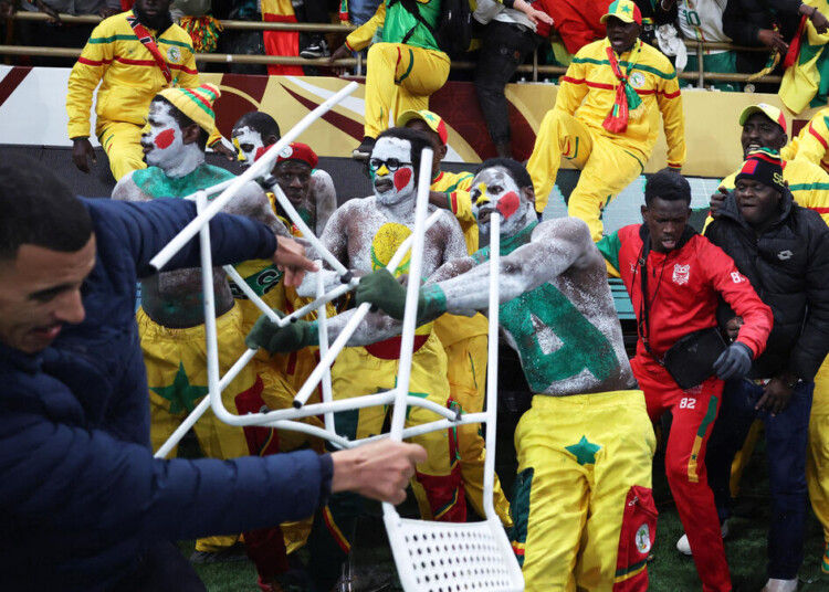 Soccer Football - CAF Africa Cup of Nations - Morocco 2025 - Final - Senegal v Morocco - Prince Moulay Abdellah Stadium, Rabat, Morocco - January 18, 2026 Senegal fans clash with security as fans invade the pitch after Morocco were awarded a penalty following a VAR review REUTERS/Siphiwe Sibeko
