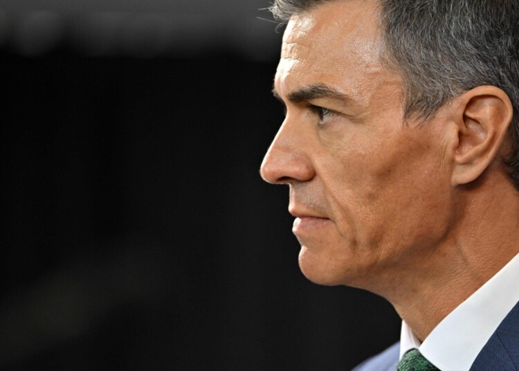 (FILES) Spanish Prime Minister Pedro Sanchez looks on after a meeting with Uruguay's President Yamandu Orsi at the Torre Ejecutiva (Executive Tower), the government's headquarters, in Montevideo on July 22, 2025. Spanish PM Pedro Sanchez hit back today at US President Donald Trump's criticisms of Madrid's refusal to let US planes use its bases to attack Iran, saying "no to war". (Photo by Santiago Mazzarovich / AFP)