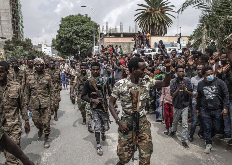 FILE -- Captured Ethiopian government soldiers are marched under guard by Tigray Defense Force fighters through the city of Mekelle, Ethiopia on June, 25, 2021. President Biden signed an executive order on Friday, Sept. 17, 2021, threatening sweeping new sanctions against leaders in the widening war in northern Ethiopia, the strongest effort yet by the United States to halt the fighting and allow urgently needed humanitarian aid to flow into the region. (Finbarr O'Reilly/The New York Times) *** Local Caption *** AFRICA ETHIOPIA SOLDIERS TIGRAY REGION TIGRAYAN PEOPLE’S LIBERATION FRONT